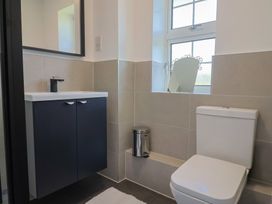A bathroom with a sink and toilet at Oakwood in Chideock
