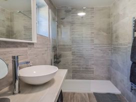 A bathroom with a sink and shower at Oakwood in Chideock