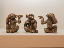 Three decorative monkey figurines positioned in a row at Gavin and Stacey House in Barry