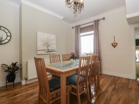 A dining room with a table and chairs at Gavin and Stacey House in Barry