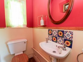 A bathroom with a sink and toilet at Ty Caredig in Swansea