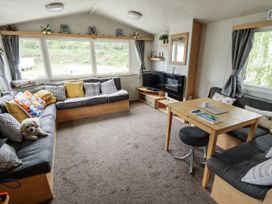 A living room with a sofa and coffee table at 31 Castle View in Lincoln