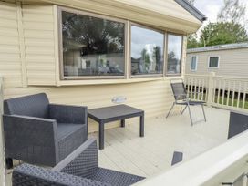 An outdoor seating area with chairs and a table at 31 Castle View, Lincoln