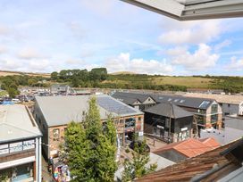 A view of buildings and cars from a rooftop at Rockside in Salcombe