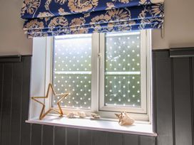 A window with seashells on the sill at Rockside in Salcombe