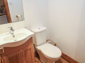 A bathroom with a sink and toilet at 1 Rowes Cottages in Penzance