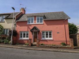 A house with a pink exterior and windows at 13 School Road Newton Abbot