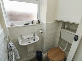 A bathroom with a basin and toilet at 13 School Road in Newton Abbot