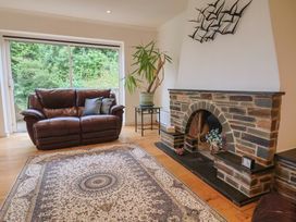 A living room with a sofa and fireplace at Hawksdown in Lyme Regis