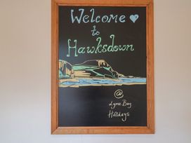 A sign with a welcome message at Hawksdown in Lyme Regis