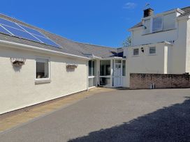 An outdoor area with solar panels on a house at Hawksdown Lyme Regis