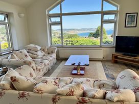 A living room with a view overlooking the sea at Hawksdown Lyme Regis