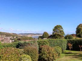 A view of houses and trees in a garden at Hawksdown Lyme Regis