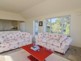 A living room with sofas and a coffee table at Hawksdown in Lyme Regis