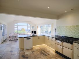 A kitchen with a stove and sink at Hawksdown in Lyme Regis