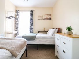 A bedroom with two beds and a dresser at Dover Retreat