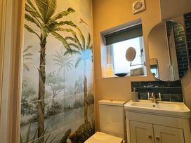 A bathroom with a sink and toilet at Bohemian Beach Cottage in Bournemouth