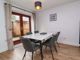 A dining room with a table and chairs at Butterfly Days in Bideford