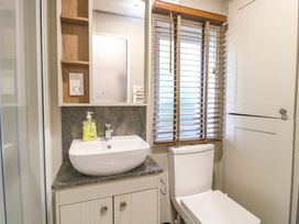 A bathroom with a sink and toilet at 17 Castle Walk in Great Yarmouth