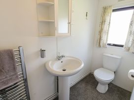 A bathroom with a sink and toilet at Springtime Lodge near Rhyd-y-Foel Abergele