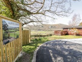 An outdoor area with a sign for Alpine Lodges at Springtime Lodge Rhyd-y-Foel near Abergele