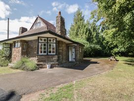 A house with a front door and windows at Raglan Lodge in Monmouth