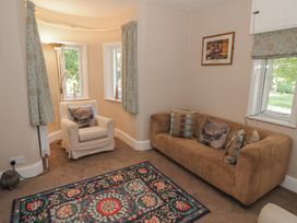 A snug with a sofa and chair at Boxbush Lodge in Monmouth