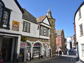A street scene with buildings and people at 5B Bridge Street in Lyme Regis