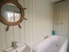 A bathroom with a sink and bathtub at 5B Bridge Street, Lyme Regis