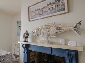A dining room with fish decoration and a figurine at 5B Bridge Street in Lyme Regis