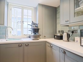 A kitchen with a sink and window at 5B Bridge Street Lyme Regis