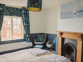 A bedroom with a window and bed at 5B Bridge Street Lyme Regis