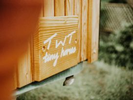 A sign for TWT tiny houses