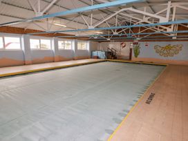 An indoor pool area with a covered swimming pool at Chalet 26 in Scurlage