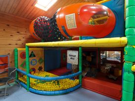 A play area with a tunnel and ball pit at Chalet 26 Scurlage
