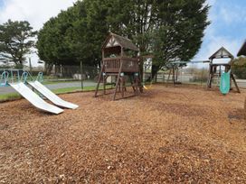 A playground with play structure and slides at Chalet 26 in Scurlage