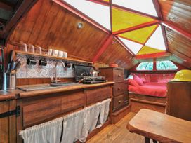 A kitchen with a stove and sink at Dashing Dennis - 22 Chapmanswell near Launceston