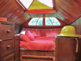 A bedroom with a bed and drawers at Dashing Dennis - 22 Chapmanswell near Launceston