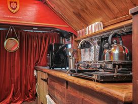 A kitchen with a coffee maker and stove at Dashing Dennis - 22 Chapmanswell near Launceston