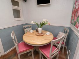 A dining room with a round table and chairs at 5 Jackson Terrace Morpeth