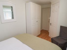A bedroom with a bed and wardrobe at 5 Jackson Terrace Morpeth