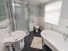 A bathroom with a shower, sink, toilet, and bathtub at 5 Jackson Terrace in Morpeth