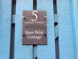 A sign indicating Rose Briar Cottage at 5 Jackson Terrace