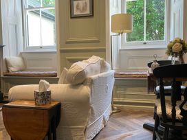 A living room with a sofa and coffee table at Garden Apartment in Par