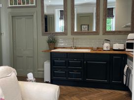 A kitchen with a sink and appliances at Garden Apartment in Par