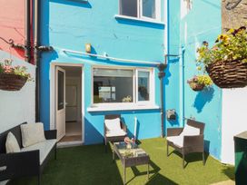 An outdoor seating area with chairs and a table at 1 Windermere in Kinvara, County Galway