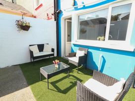 An outdoor patio with seating and a table at 1 Windermere, Kinvara, County Galway