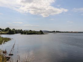 A view of a river with trees and land along the shore at 1 Windermere in Kinvara, County Galway