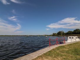 A view of water with boats and a pier at 1 Windermere, Kinvara, County Galway