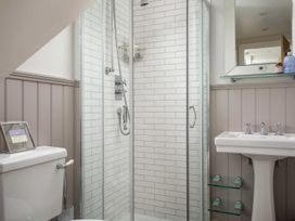 A bathroom with a shower and sink at Lavender Cottage (Stow-on-the-Wold) Cheltenham